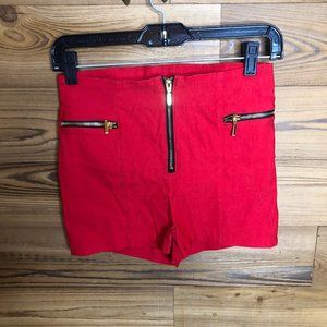 Red mini shorts with gold zipper